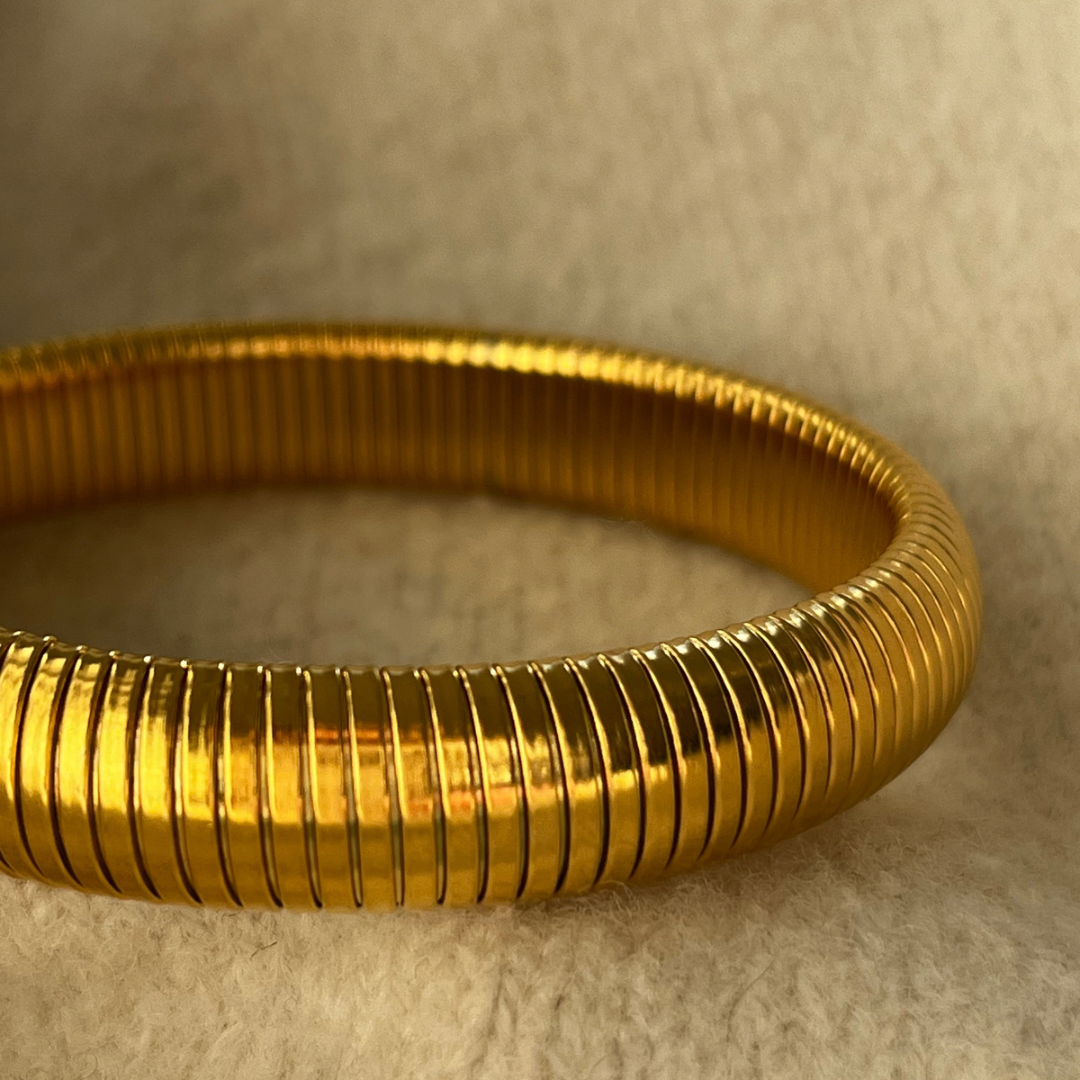 Close up of gold bangle